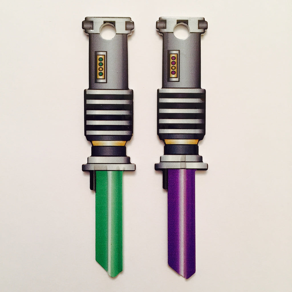 2 Green and Purple Light Saber Shaped Space Keys